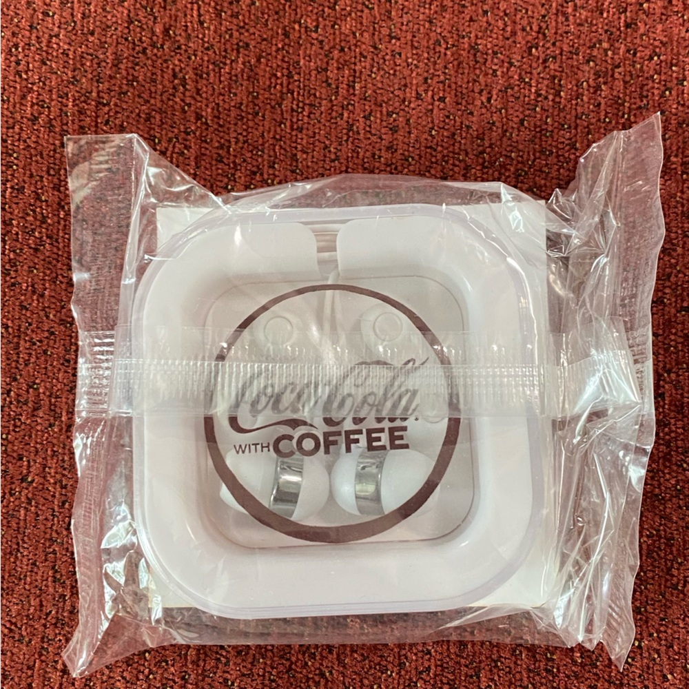 Coca-Cola with coffee wired ear phones